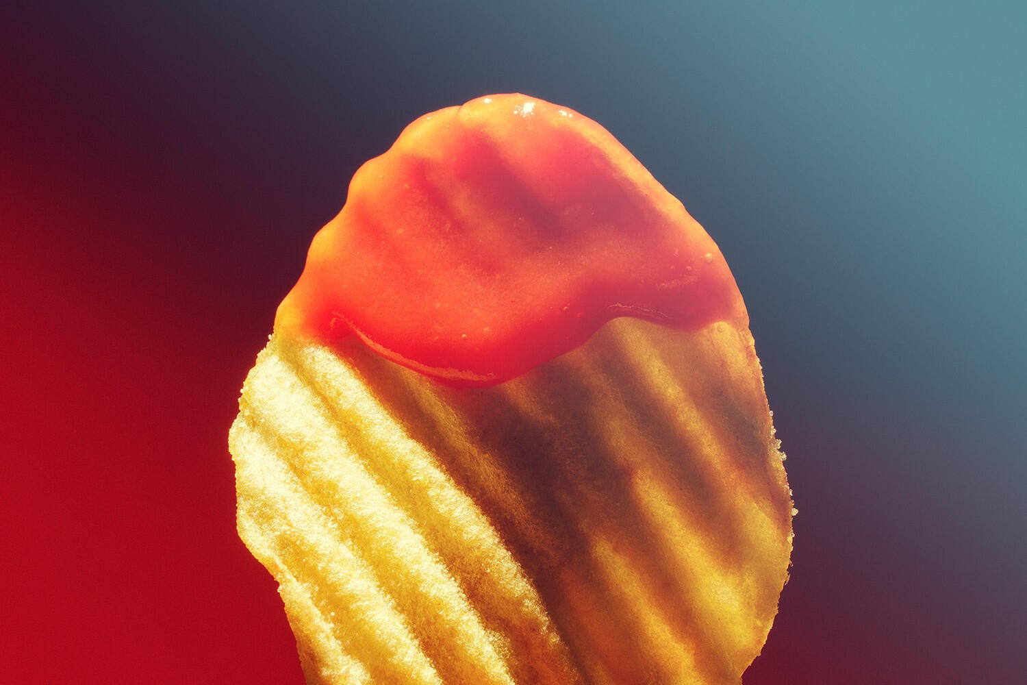 Retro macro shot of crinkled chips with ketchup Retro macro shot of crinkled chips with ketchup